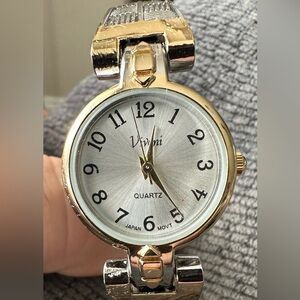 Women’s Vivani quartz (spring loaded band) watch.